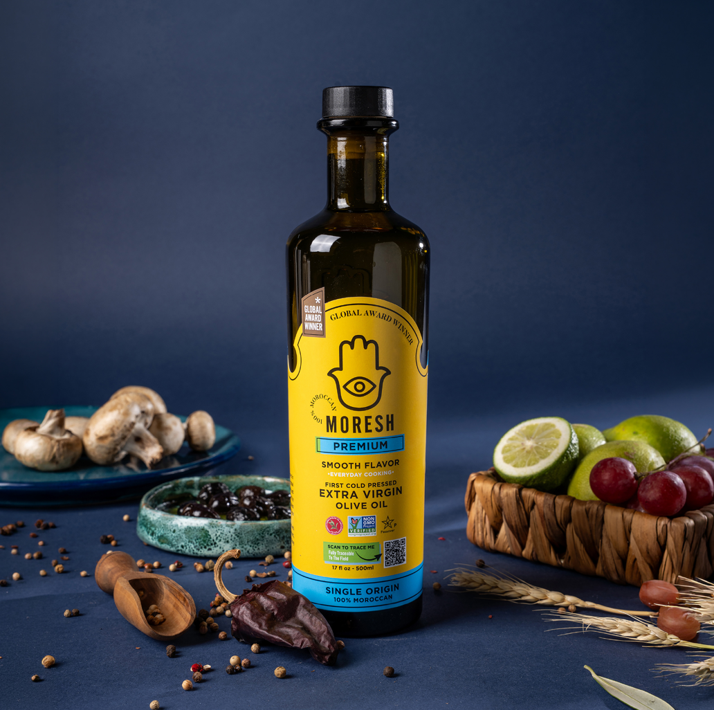 A picture featuring Moresh Premium Olive Oil 500ml with different fruits and spices